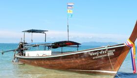 Tranquil Krabi shoreline at dawn for a Krabi Tours banner by Legend Travel Group.